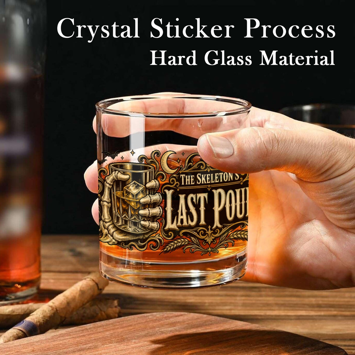Skeleton hand gripping the glass beside an ornate Last Pour label on whiskey glasses, product view 4