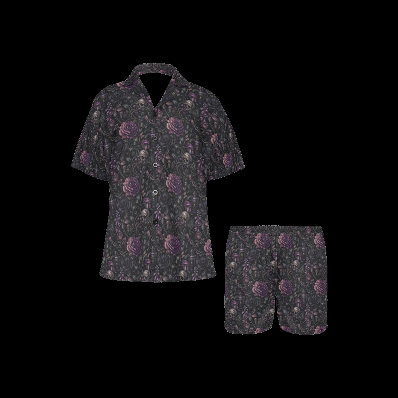 Front view of black night floral women's pajama shirt and shorts with purple skull-and-flower print on a black background