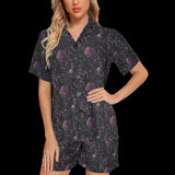 Woman modeling a black night floral short pajama set with purple gothic florals, skulls and mushrooms
