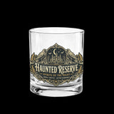 Ornate Haunted Reserve gothic spirits label on whiskey glasses