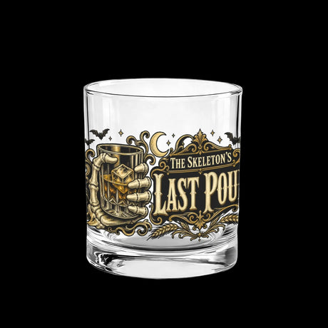 Skeleton hand gripping the glass beside an ornate Last Pour label on whiskey glasses