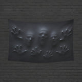 Ghostly faces and hands pressing through stretched black fabric on wall tapestries